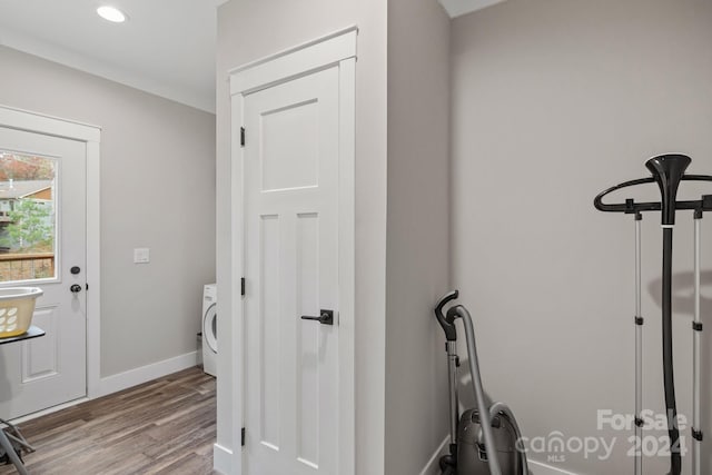 laundry room featuring light hardwood / wood-style floors and washer / dryer