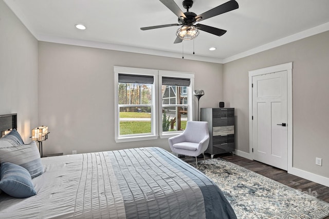 bedroom with dark hardwood / wood-style flooring and ceiling fan