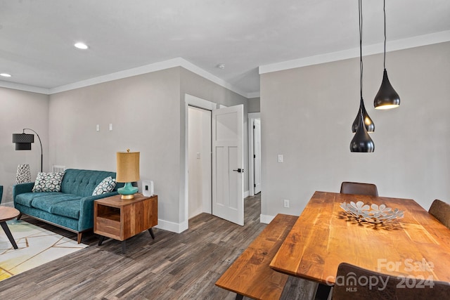 living room with ornamental molding and dark hardwood / wood-style floors