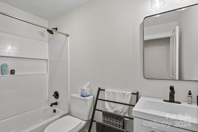 full bathroom with toilet, vanity, and tiled shower / bath combo