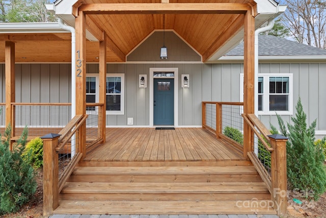 view of exterior entry featuring a porch