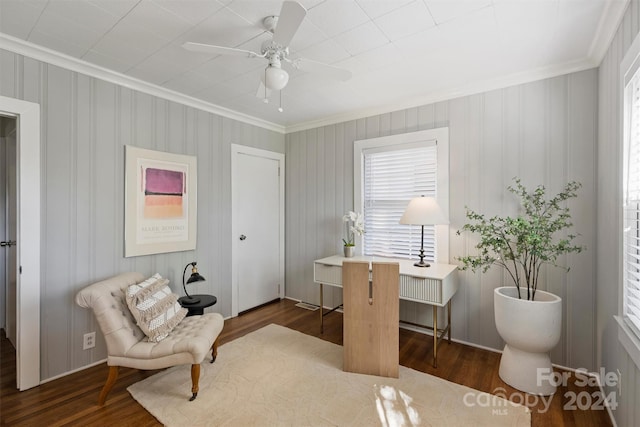 interior space featuring ceiling fan, dark hardwood / wood-style flooring, and ornamental molding