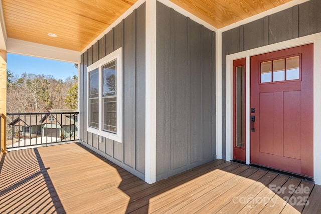 view of exterior entry featuring a porch