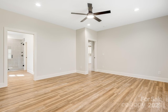 spare room with light wood-style floors, recessed lighting, and baseboards