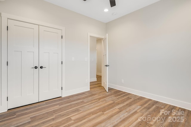 unfurnished bedroom featuring recessed lighting, a closet, light wood-style floors, ceiling fan, and baseboards