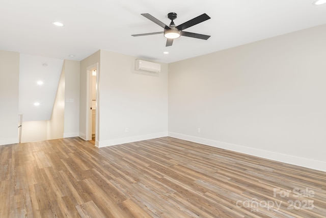 297 Bethany Dr, Mars Hill, NC 28754 - unfurnished room with a wall unit AC, light wood finished floors, recessed lighting, ceiling fan, and baseboards