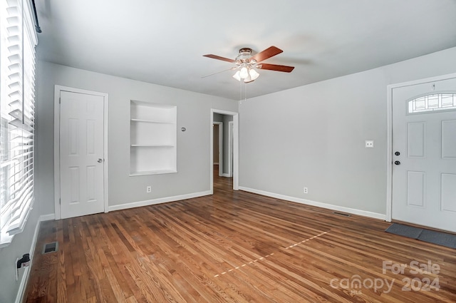 interior space with hardwood / wood-style flooring and ceiling fan