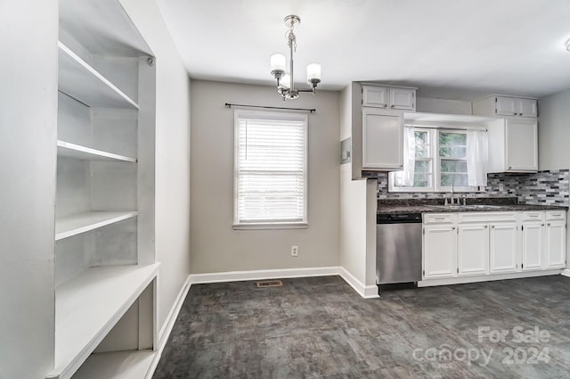 kitchen with dishwasher, tasteful backsplash, pendant lighting, and a healthy amount of sunlight