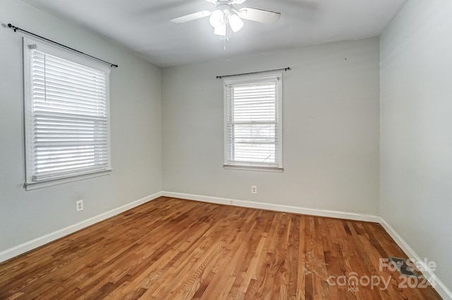 empty room featuring ceiling fan and light wood-type flooring