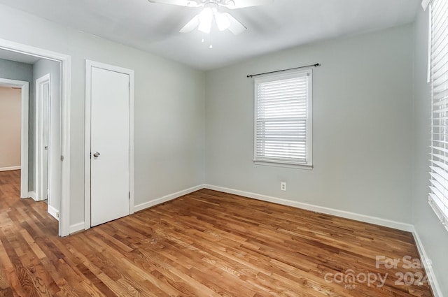 spare room featuring ceiling fan and wood-type flooring