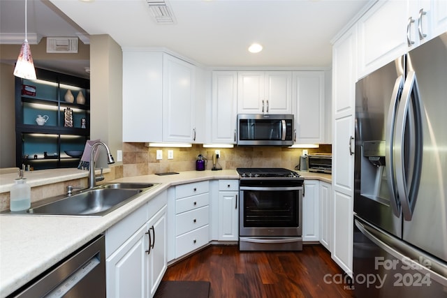 401 N Church St Unit 406, Charlotte, NC 28202 - kitchen featuring appliances with stainless steel finishes, a sink, recessed lighting, light countertops, and white cabinets