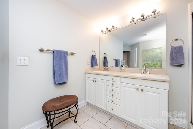 401 N Church St Unit 406, Charlotte, NC 28202 - full bathroom with double vanity, tile patterned flooring, and baseboards