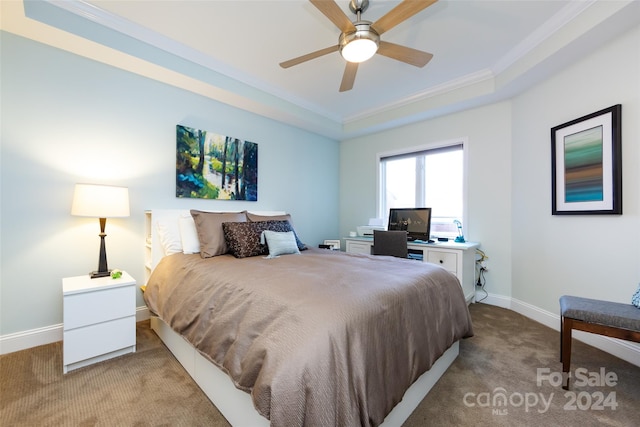 bedroom featuring light carpet, a raised ceiling, ceiling fan, and ornamental molding