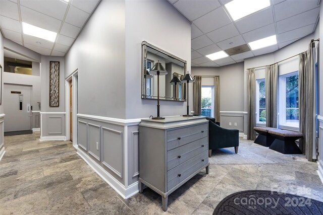 hallway with a drop ceiling