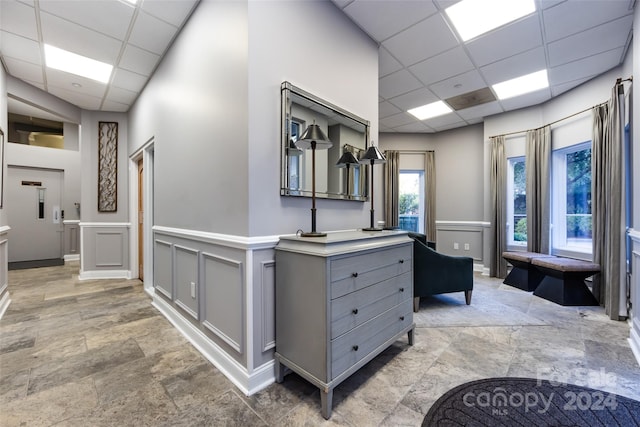 401 N Church St Unit 406, Charlotte, NC 28202 - corridor with a drop ceiling, light stone finish flooring, and baseboards