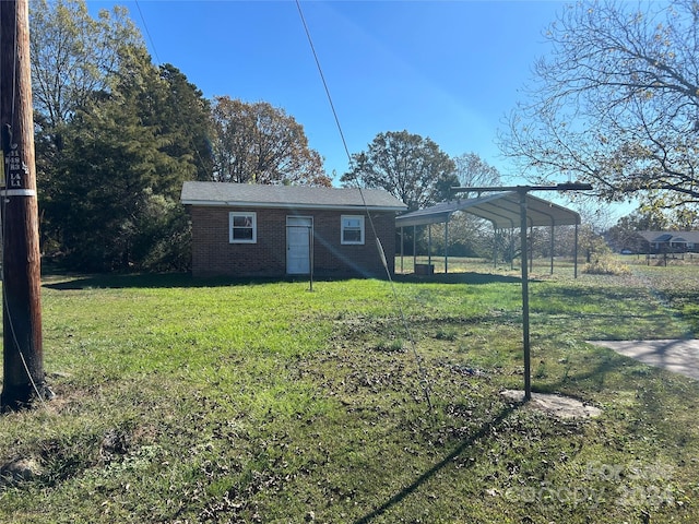 exterior space with a yard and a carport