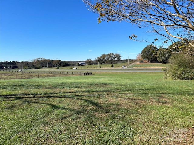 view of yard with a rural view