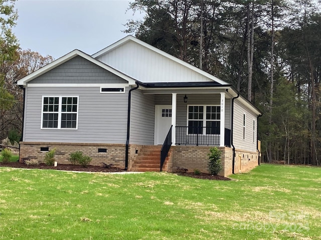 view of front of home featuring a front yard and a porch