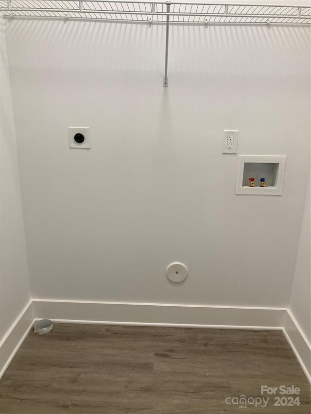 washroom featuring washer hookup, electric dryer hookup, and dark hardwood / wood-style flooring