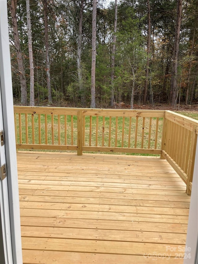 wooden deck with a yard