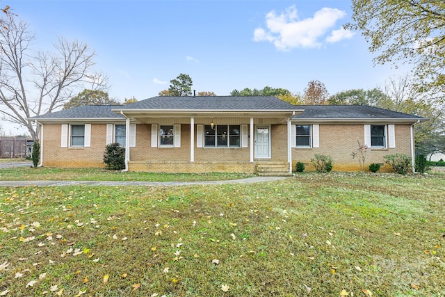 ranch-style house featuring a porch and a front lawn