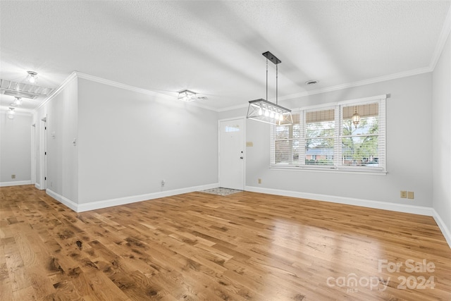 interior space featuring hardwood / wood-style floors and ornamental molding