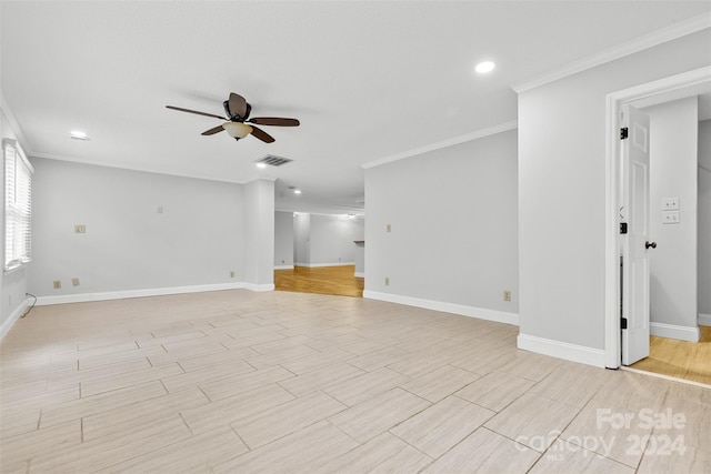 spare room with ceiling fan and ornamental molding