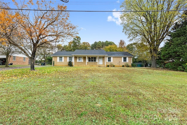 ranch-style house with a front lawn