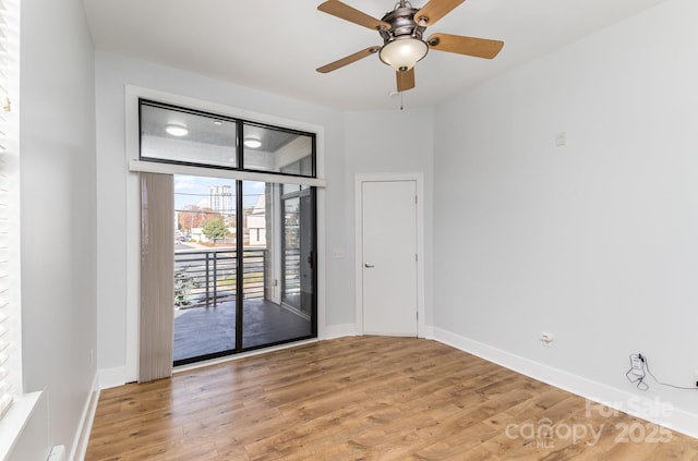 unfurnished room featuring light hardwood / wood-style floors and ceiling fan