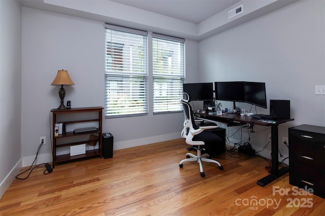 office space with light hardwood / wood-style flooring