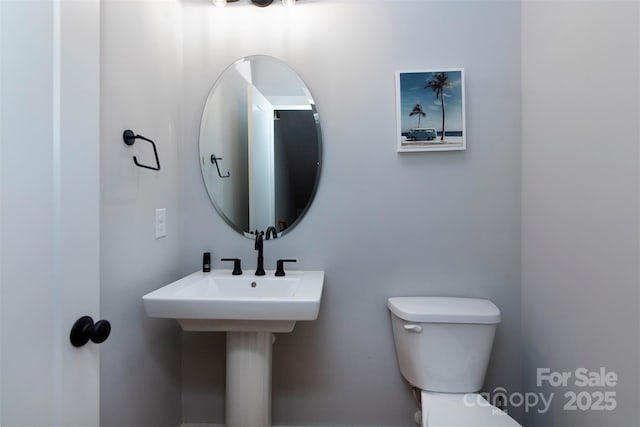 bathroom featuring toilet