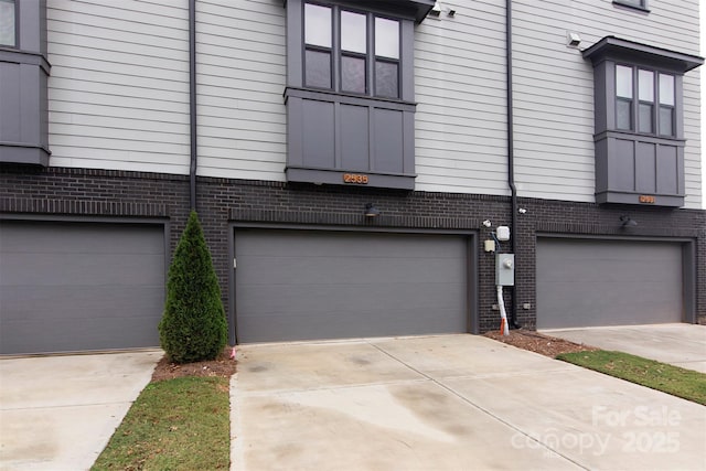 view of side of home with a garage