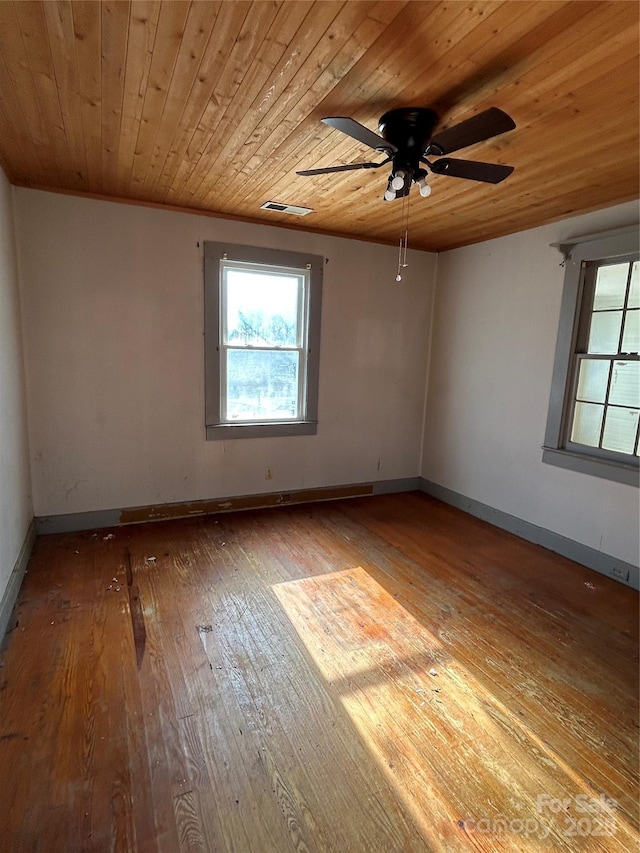 empty room with light hardwood / wood-style floors, ceiling fan, and wooden ceiling