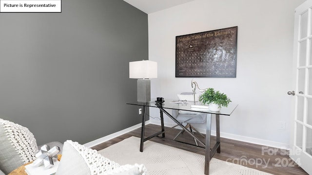 home office with hardwood / wood-style floors