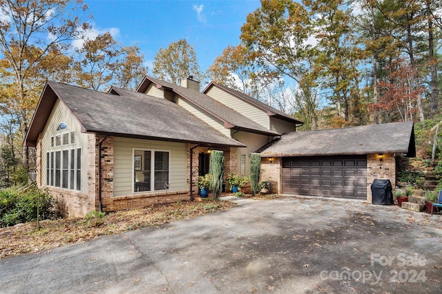 front facade with a garage