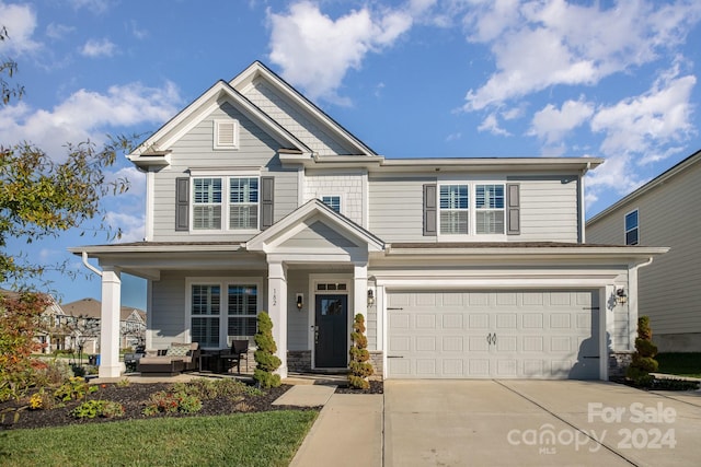 craftsman house with a garage