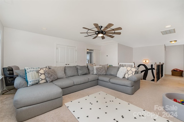 living room with carpet and ceiling fan