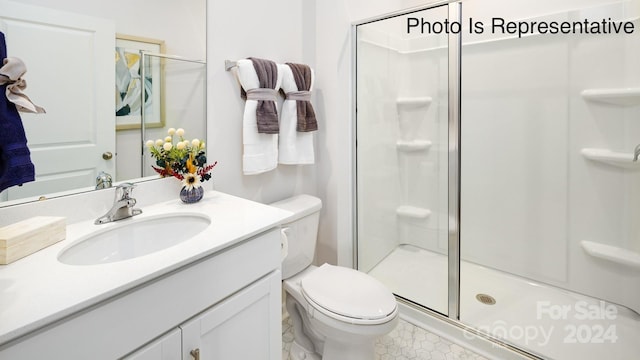 bathroom with walk in shower, vanity, and toilet