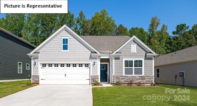 craftsman-style home with a garage and a front yard