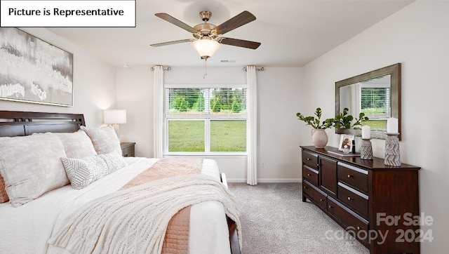 bedroom with light carpet and ceiling fan