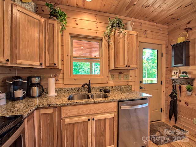 kitchen with sink, wooden walls, light stone counters, wooden ceiling, and stainless steel dishwasher