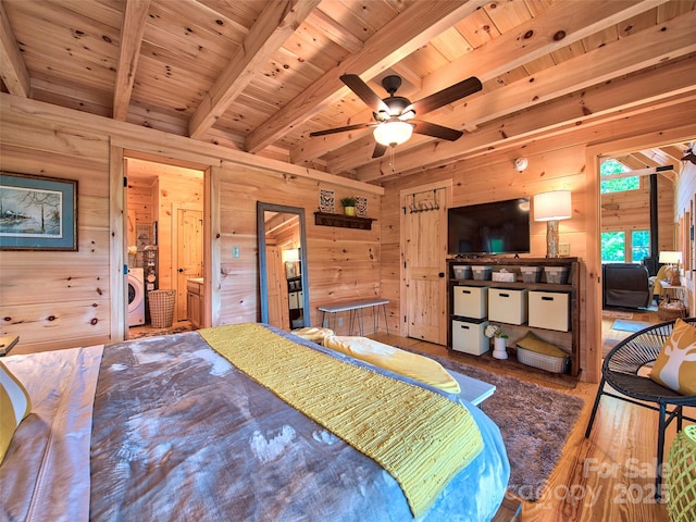 bedroom featuring washer / dryer, wooden walls, wooden ceiling, and beamed ceiling