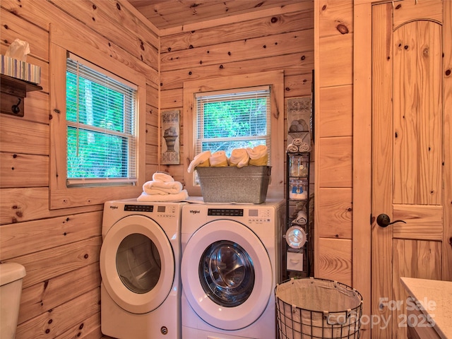 washroom with independent washer and dryer