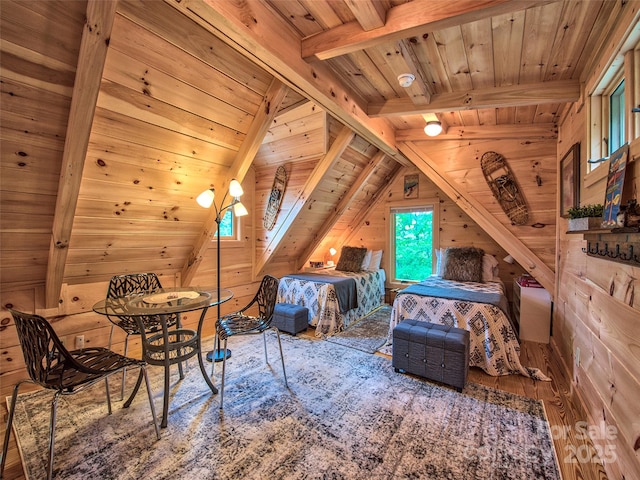 bedroom featuring wood ceiling, wooden walls, hardwood / wood-style floors, and lofted ceiling with beams