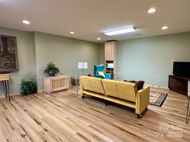 living room with light hardwood / wood-style floors