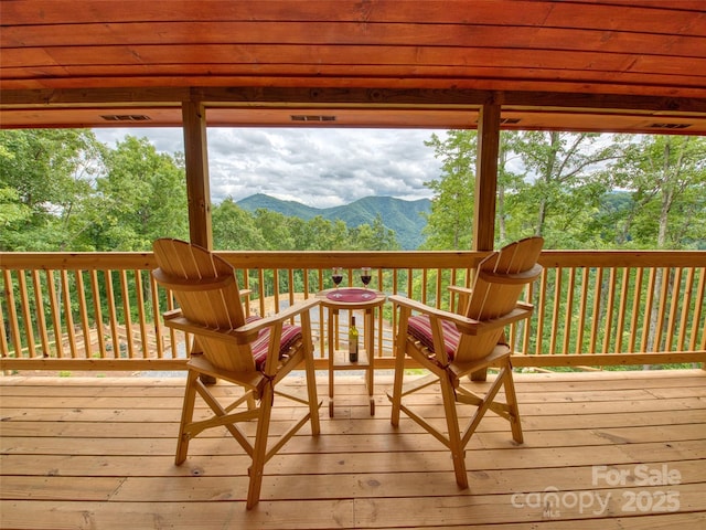 wooden terrace with a mountain view