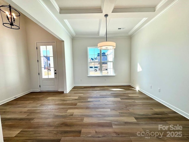 unfurnished dining area with beamed ceiling, dark wood-type flooring, an inviting chandelier, and coffered ceiling