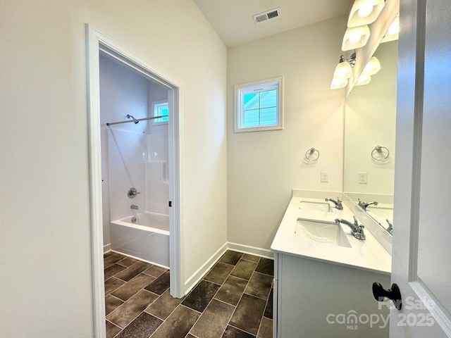 bathroom with shower / bath combination and vanity