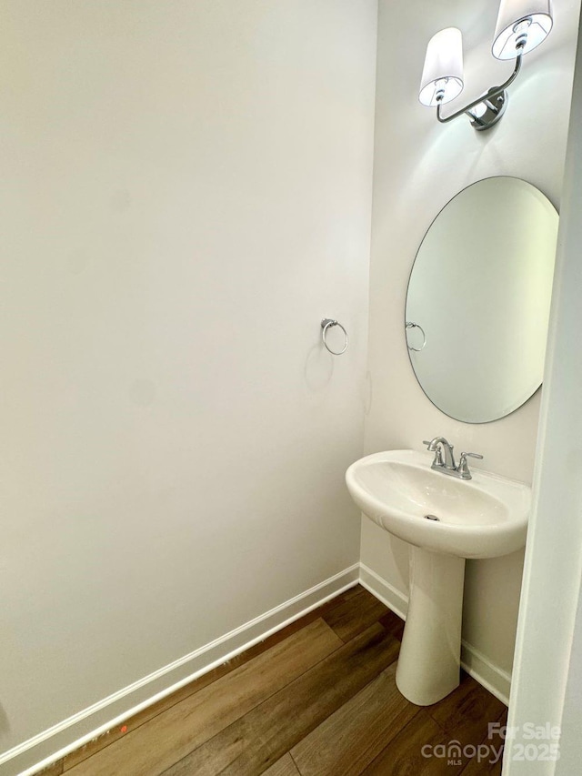 bathroom with hardwood / wood-style floors