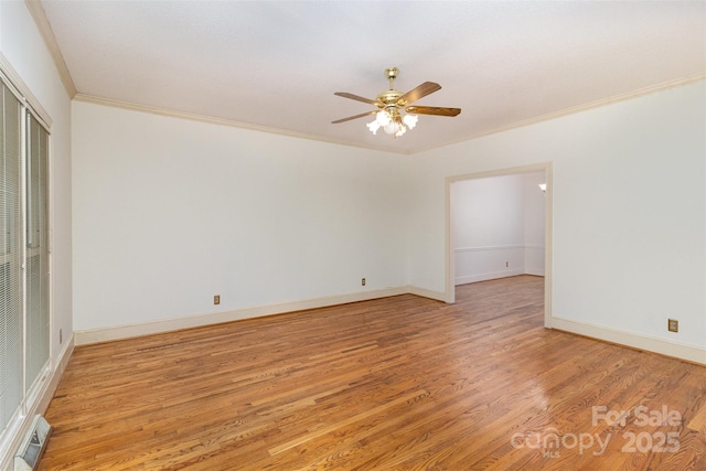 empty room featuring visible vents, light wood-style flooring, ornamental molding, ceiling fan, and baseboards